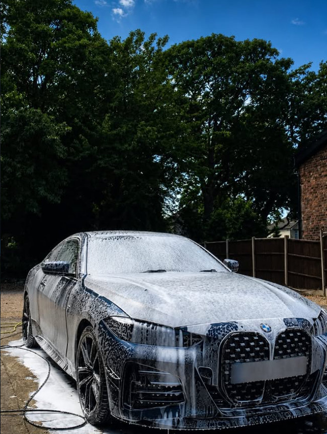 BMW 4 Series under snow foam during an Exterior Valet by Grassendale Valet